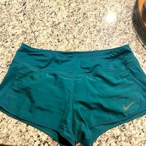 Green Nike running shorts
